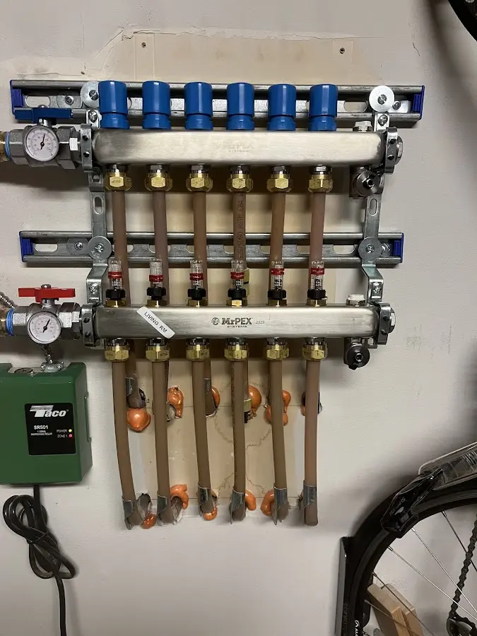 Plumber performing Water Heater Repair at a residential property in New Castle